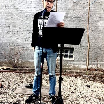 JJ performs in the yard behind Unnameable Books in Brooklyn