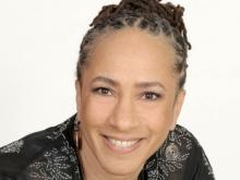 headshot of Lorene Cary in black top and silver earrings