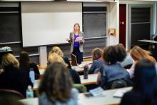 Jennifer Egan lectures from front of classroom