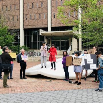 Over two dozen students, faculty, and local residents gathered on Monday in front of the Button with signs supporting Penn Book Center